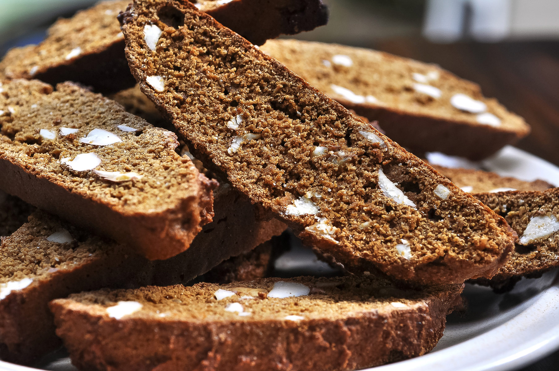 Stack of Gingerbread Biscotti with sliced almonds in them; Gingerbread Biscotti, Jane Bonacci, The Heritage Cook.