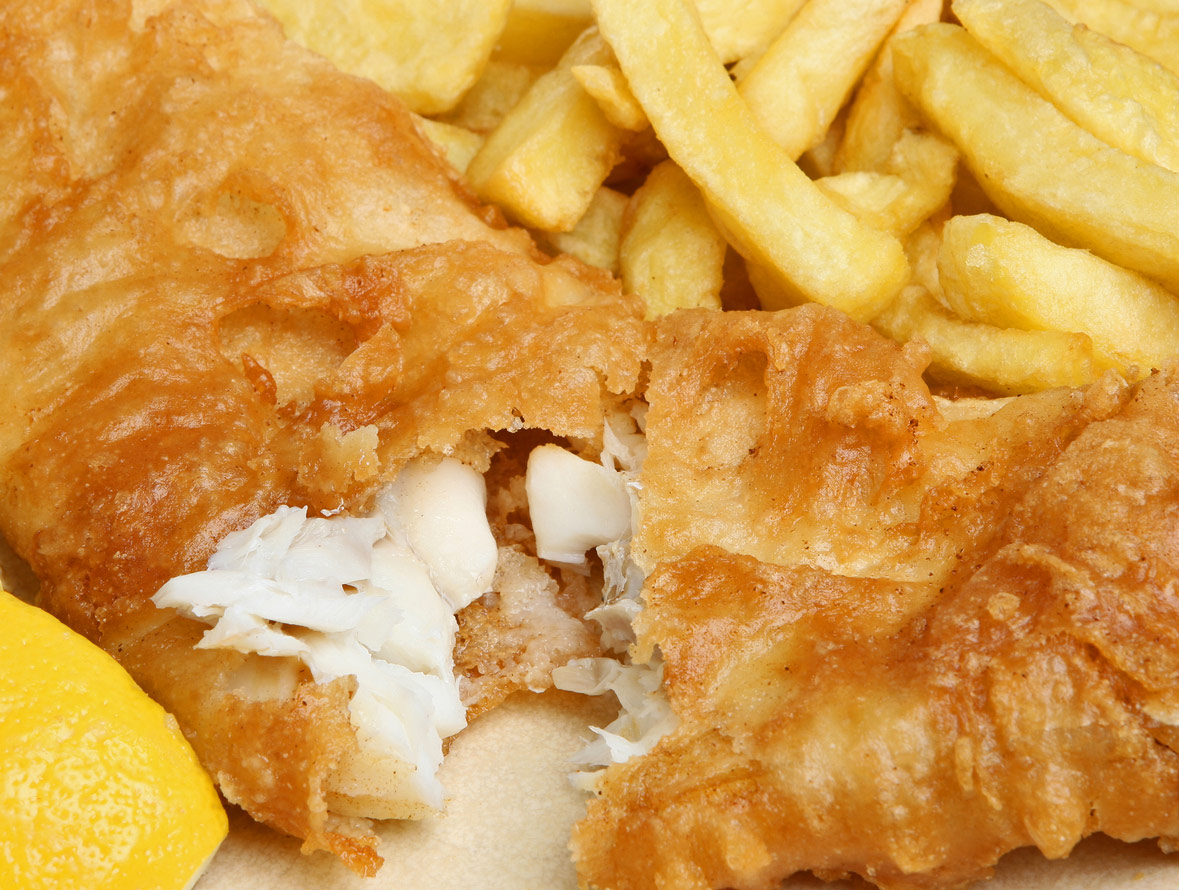 Perfectly fried fillets of fish with piles of French fries or chips and tartar sauce; Crispy Fish and Chips; Jane Bonacci, The Heritage Cook.