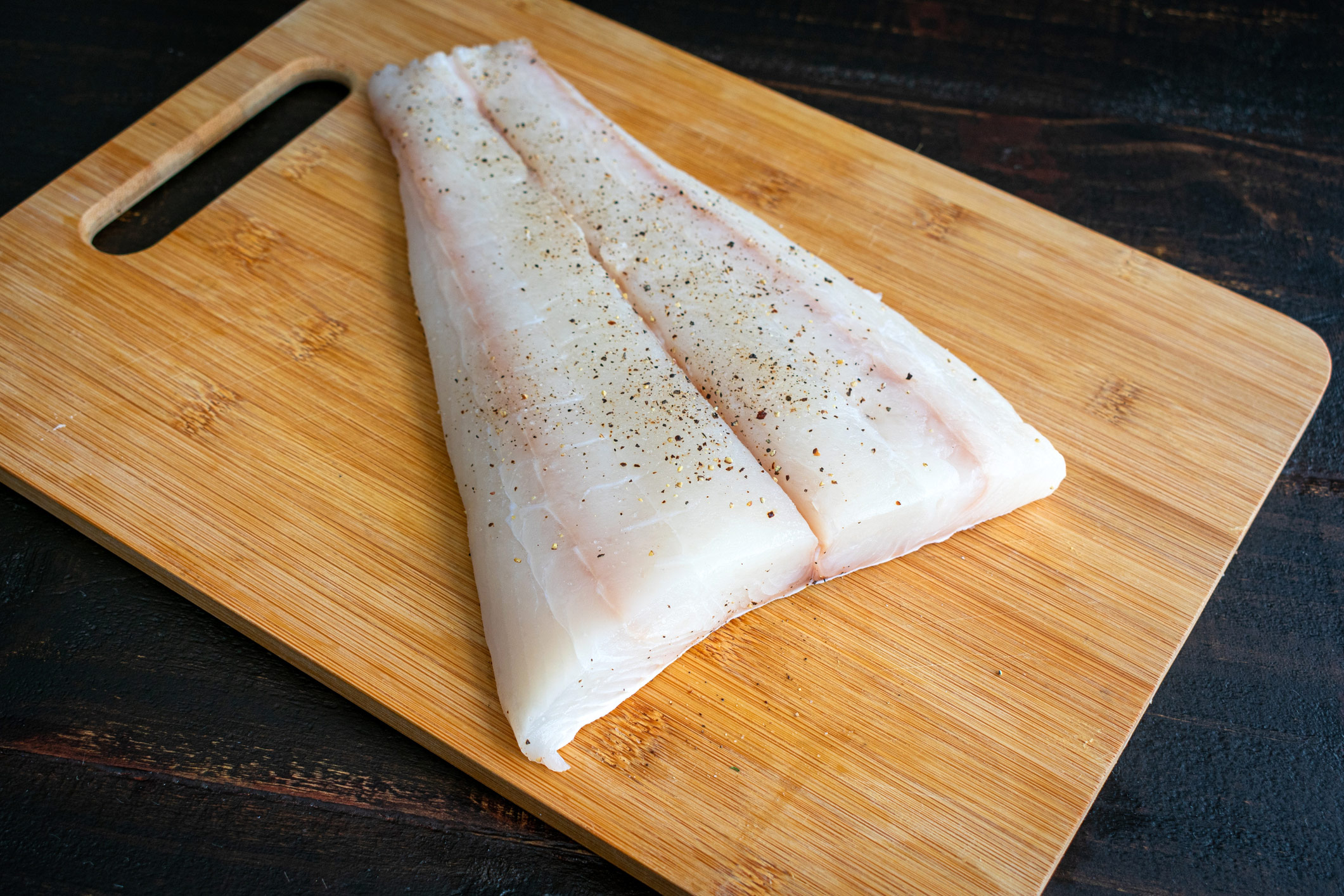 A beautiful piece of white fish ready to be cut into portions and cooked. 