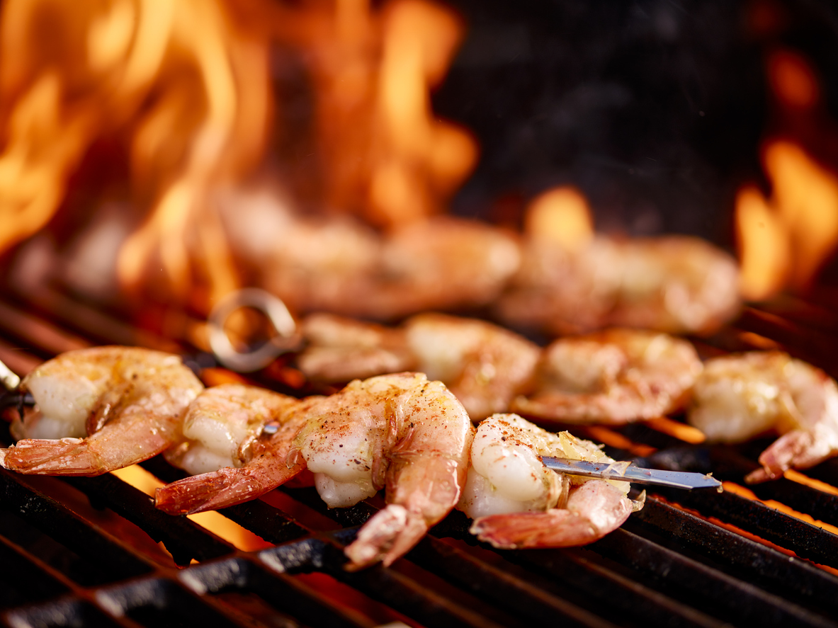 skewers of shrimp on hot grill; Grilled Cajun Shrimp Skewers 2021 Jane Bonacci, The Heritage Cook