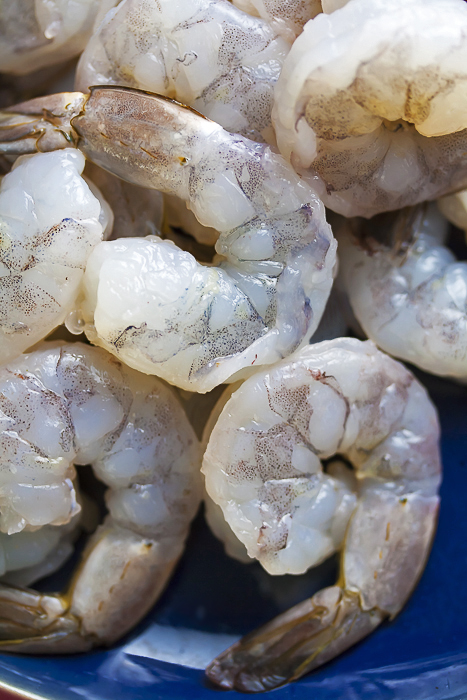 Pile of raw shrimp ready for skewering; Grilled Cajun Shrimp Skewers 2021 Jane Bonacci, The Heritage Cook