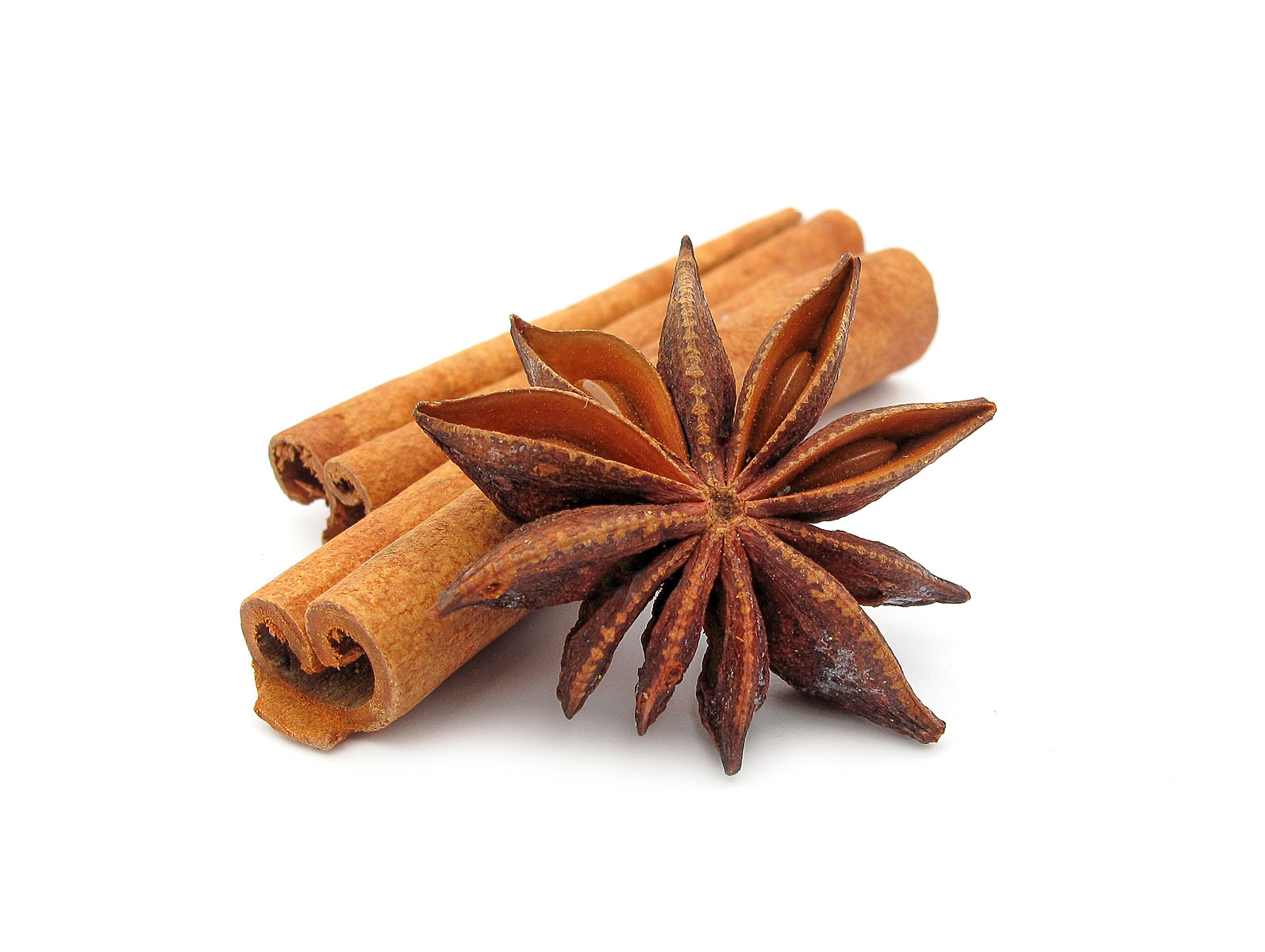 cinnamon sticks and star anise on white background. 