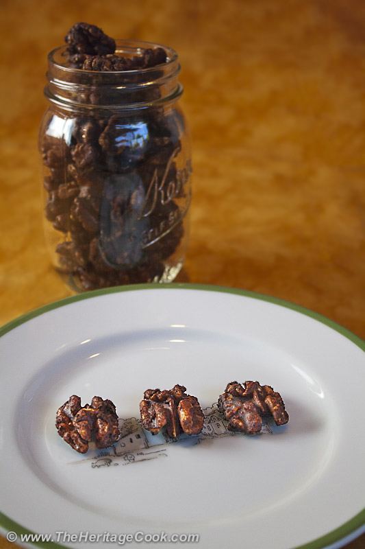 Jar of Cocoa-coated walnuts and sample on a plate