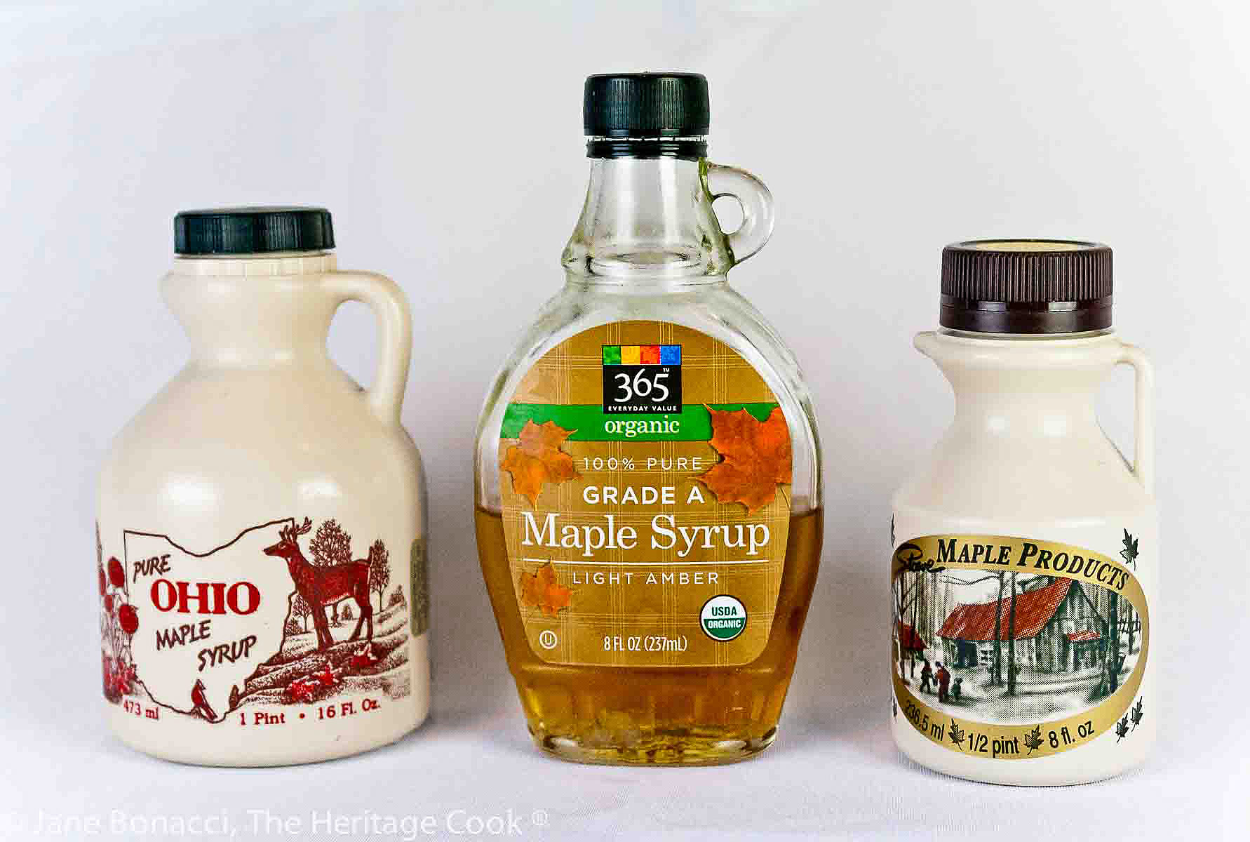 3 different bottles of maple syrup. 