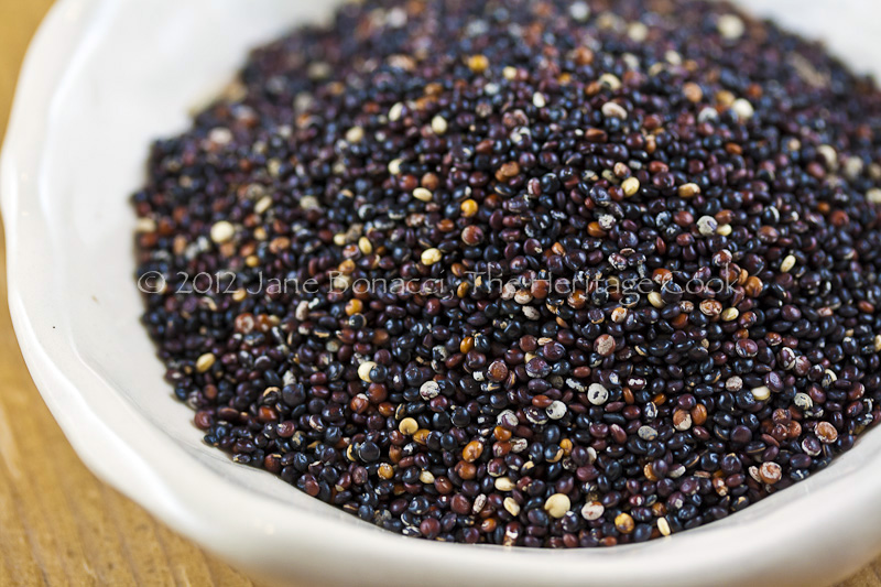 Small bowl of raw black quinoa