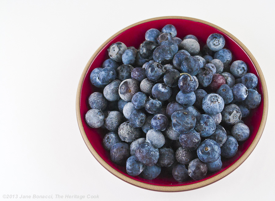 Homemade Blueberry Jam from The Heritage Cook; bowl of fresh blueberries on a white background