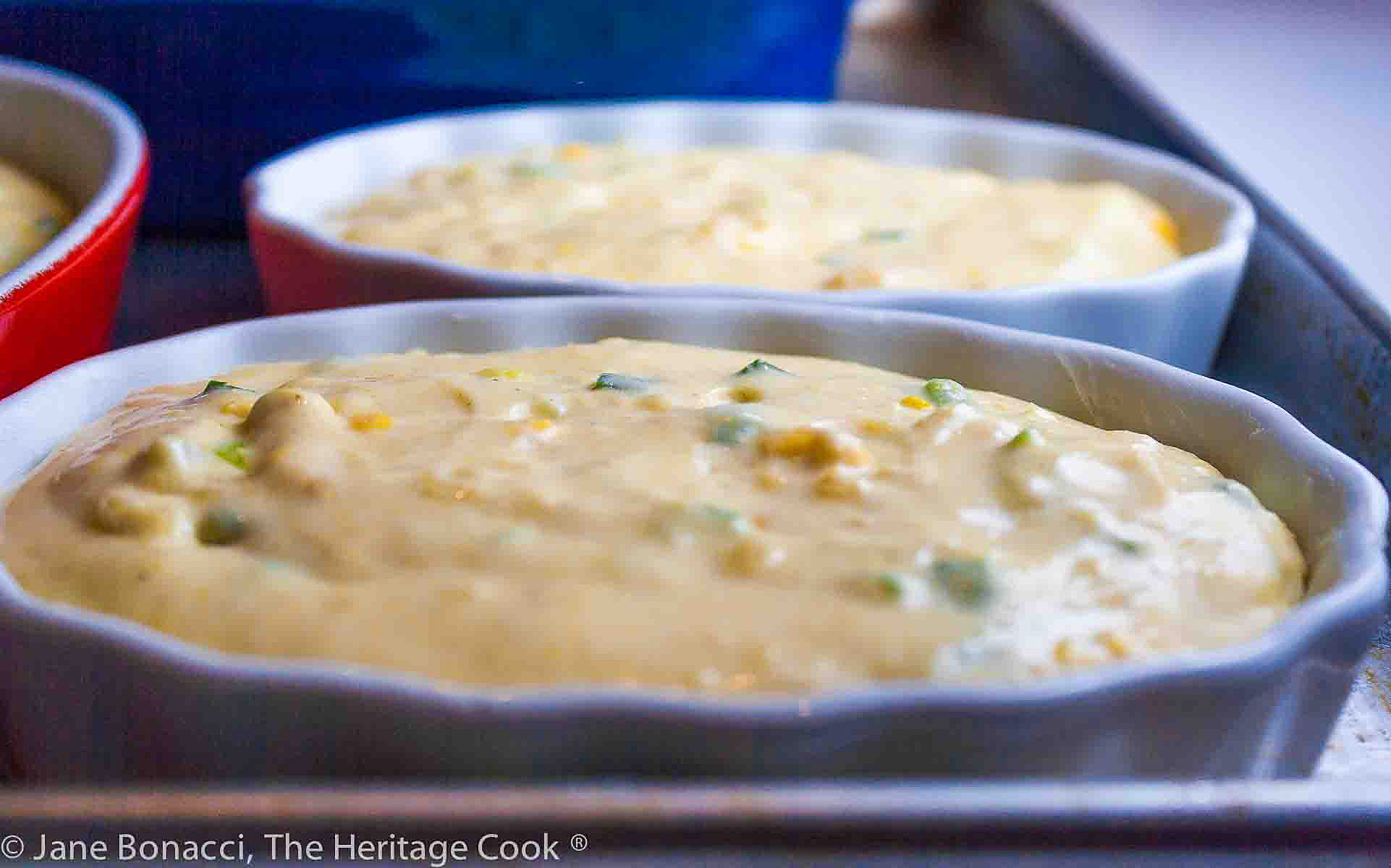 Au gratin dishes with batter in them ready for the oven. 