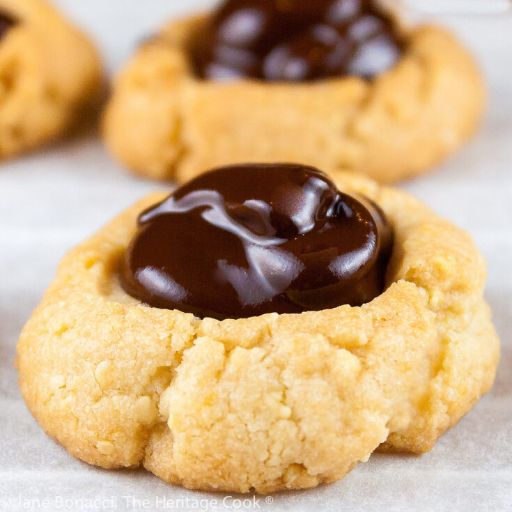 Close up of an Almond Chocolate Thumbprint cookie.