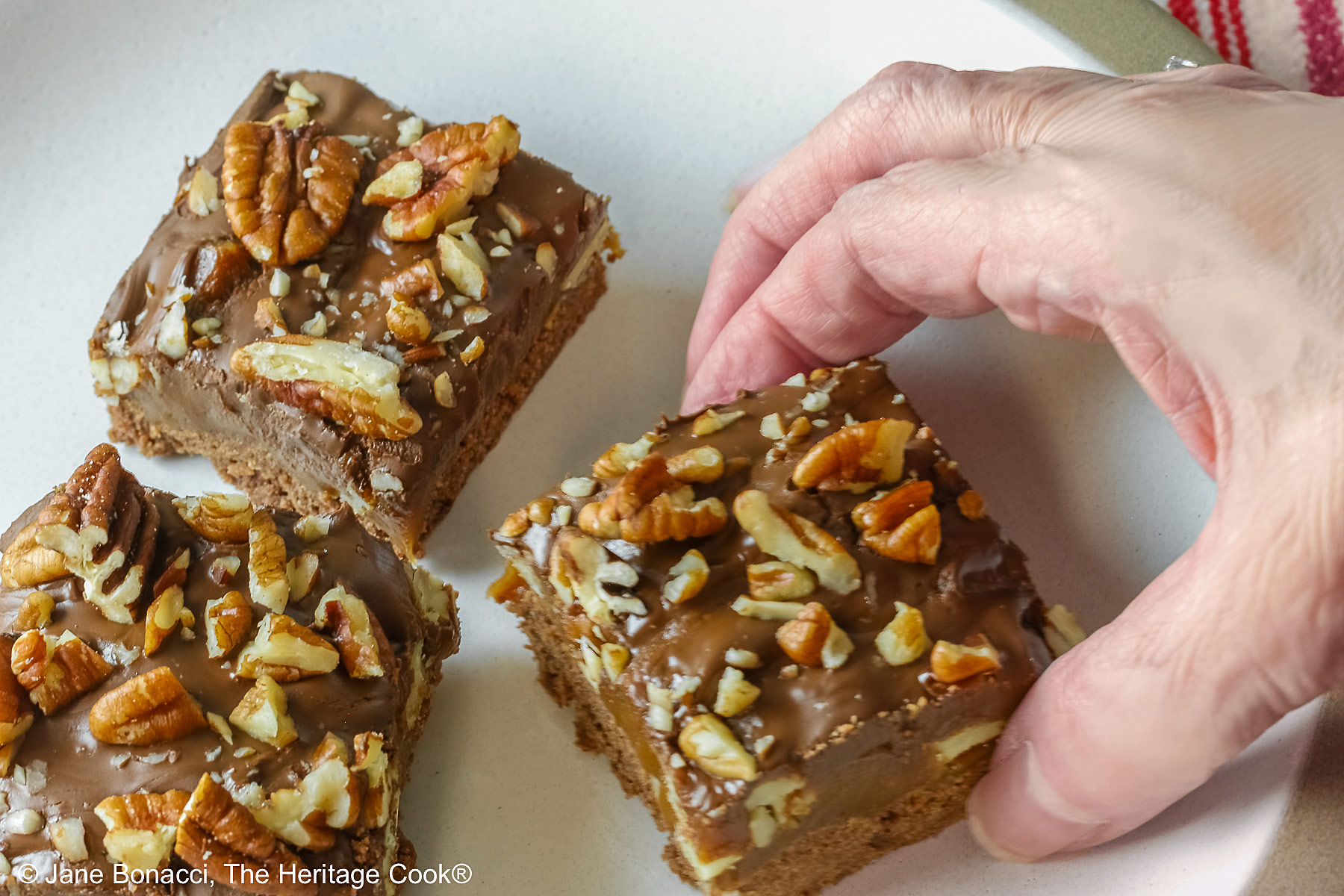 Hand grabbing a piece when no one is looking.