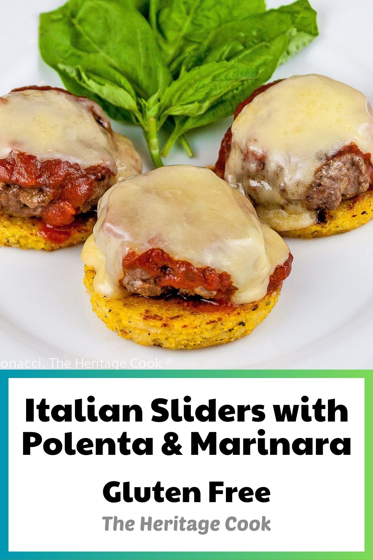 Mini burger patties on firm polenta circles, topped with fresh marinara sauce and melted cheese, then sprinkled with basil. Italian Sliders with Polenta and Marinara (Gluten Free); © 2023 Jane Bonacci, The Heritage Cook. 