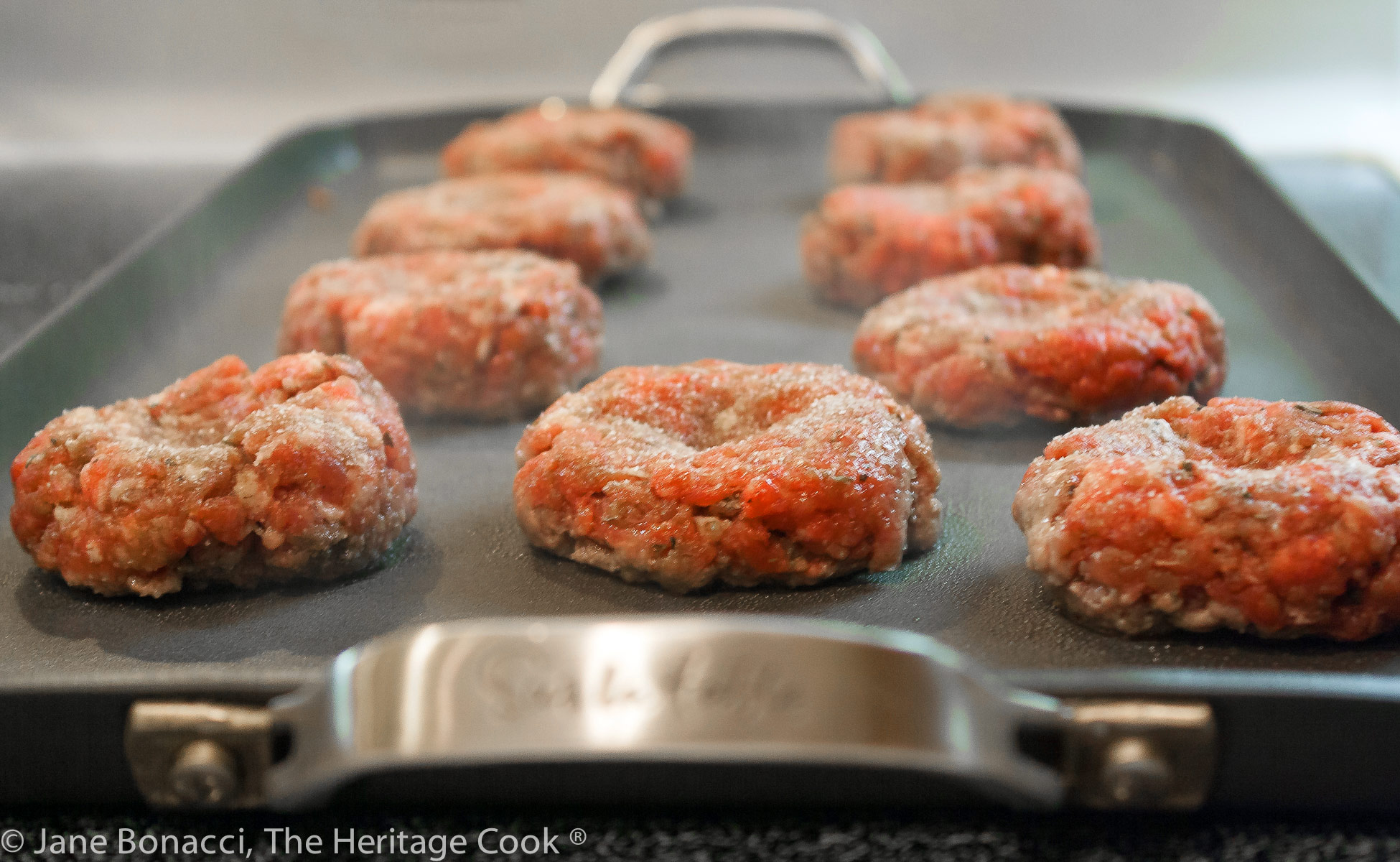 The divot in the burgers helps keep them from bulging as they cook!