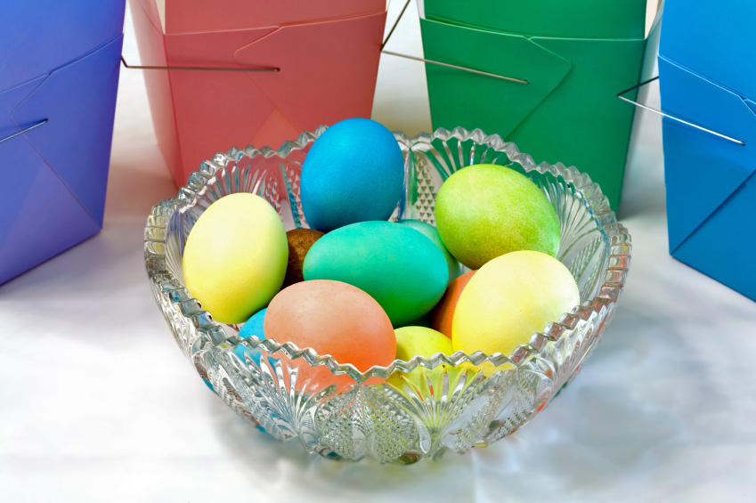 Glass bowl filled with brightly colored Easter Eggs