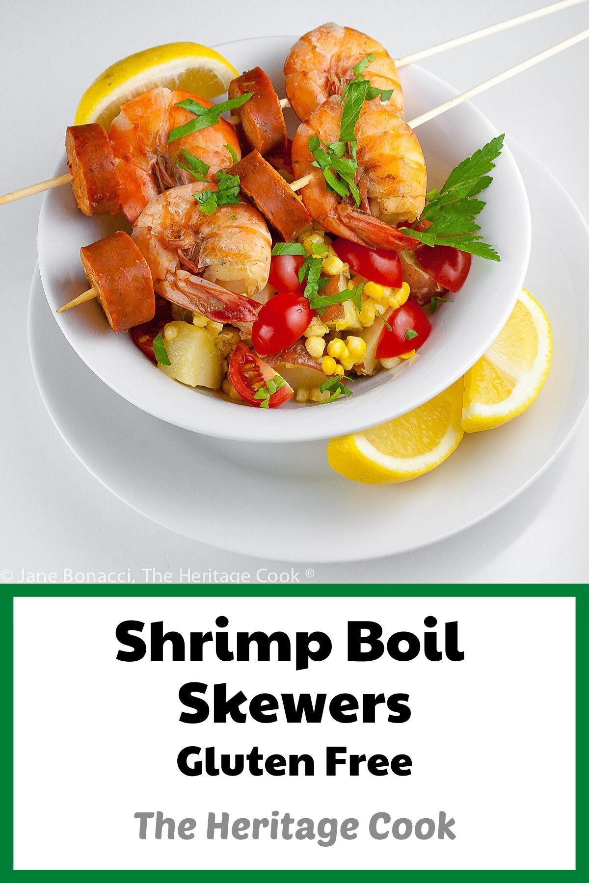 Bowl with fresh corn, potatoes and tomatoes topped by Shrimp Boil Skewers © 2022 Jane Bonacci, The Heritage Cook