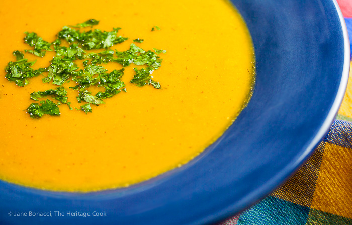 A big healthy bowl of roasted carrot and sweet potato soup, filling and delicious on crisp autumn days and all winter long