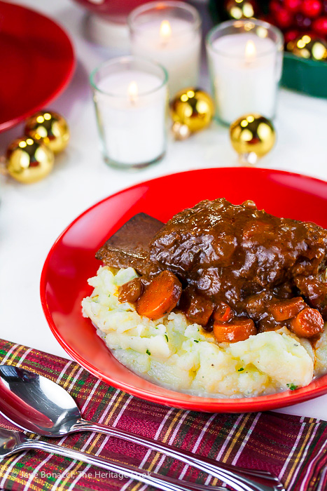 red wine braised short ribs served over garlic mashed potatoes for a wonderful comfort food holiday meal