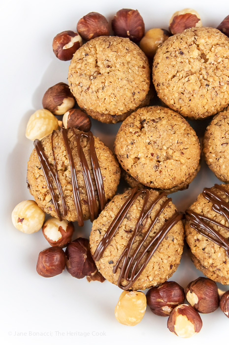 plate full of Hazelnut Chocolate Cookies (gluten free) with hazelnuts