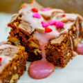 Brownies drizzled with orange glaze and sprinkled with red and pink decorations for Valentine’s Day; Valentine’s Day Brownies with Orange Glaze © 2023 Jane Bonacci, The Heritage Cook.
