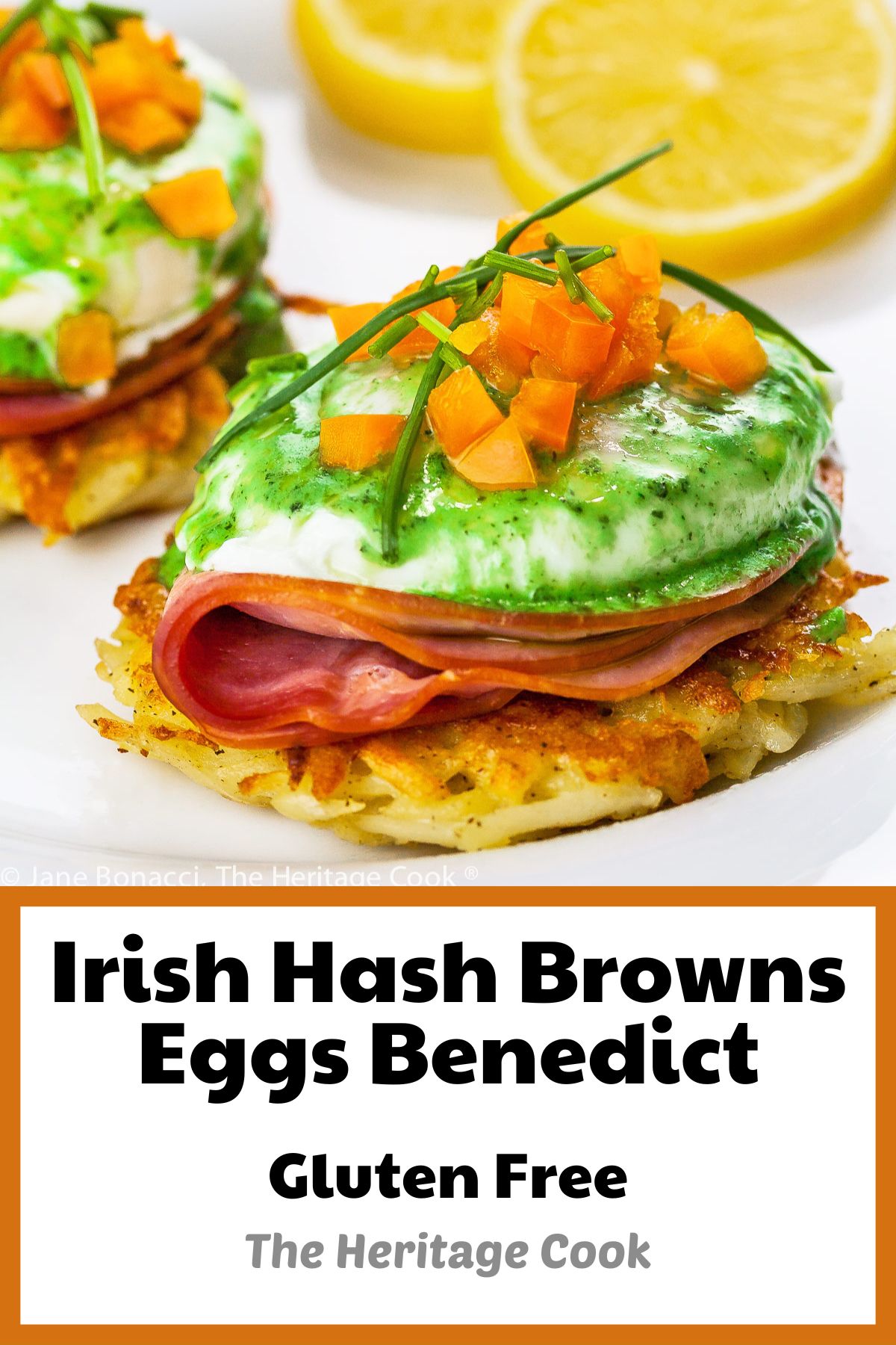 Potato pancakes topped with a slice of ham, a poached egg, basil hollandaise sauce, finely chopped orange bell peppers, and chives; Irish Hash Browns Benedict with Basil Hollandaise; © 2023 Jane Bonacci, The Heritage Cook. 