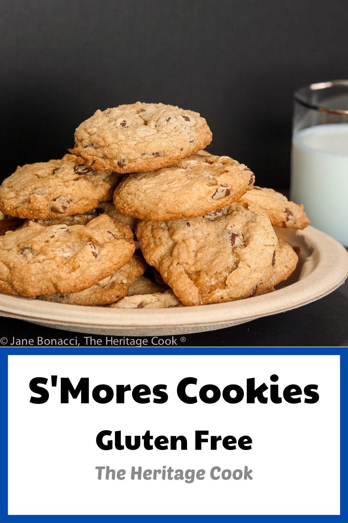 Pile of cookies on a plate with a glass of milk in the background; S’mores Chocolate Chip Cookies (Gluten Free) © 2022 Jane Bonacci, The Heritage Cook