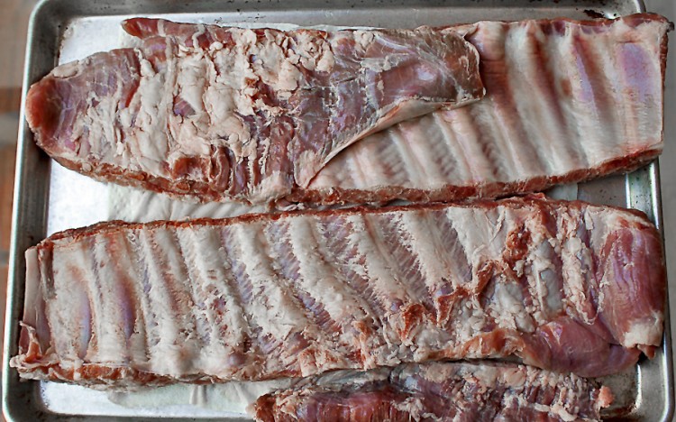 Prepping ribs is easy; the rack on the top as I bought it; the rack on the bottom after the flap and silverskin are removed