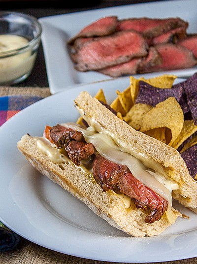 BBQ Steak covered with melted cheese and more in these amazing sandwiches perfect for tailgating or any party; Cheesy Grilled Steak Sandwiches; 2015 Jane Bonacci, The Heritage Cook
