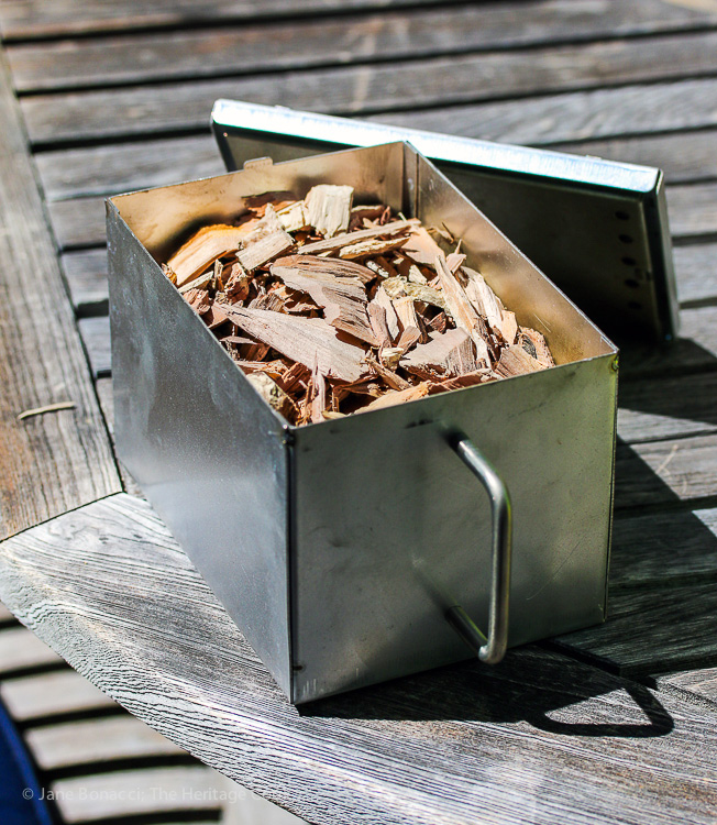 Smoker box filled with wood chips
