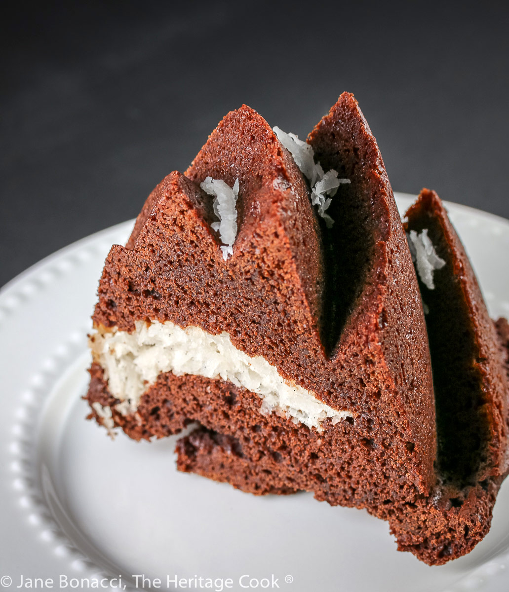 slice of cake on plate; Almond Joy Bundt Cake; © 2022 Jane Bonacci, The Heritage Cook