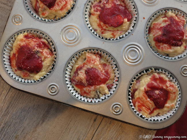 Roasted Strawberries tucked into the batter before baking; Banana Chocolate Chip Muffins with Roasted Strawberries; © Beth Lee 2016