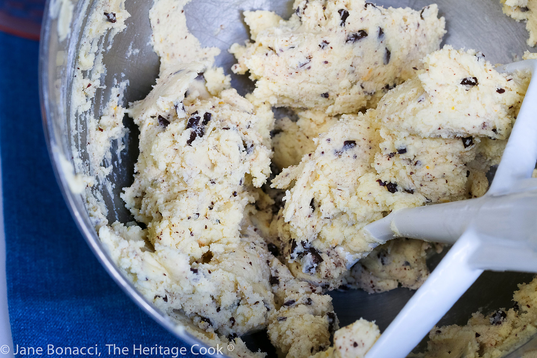 Raw cookie dough in mixer bowl. 