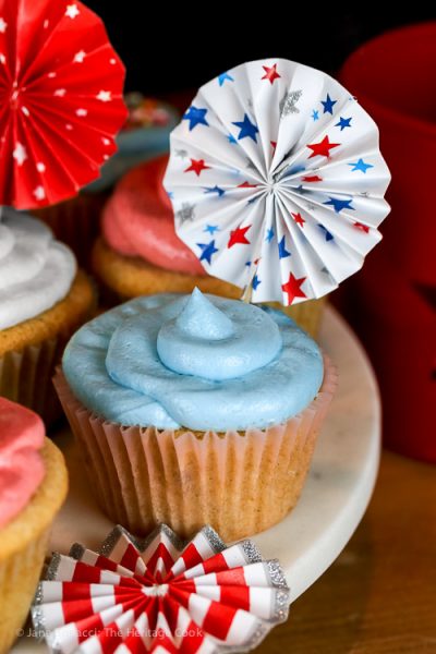 Collection of red, white, and blue cupcakes with 4th of July decorations