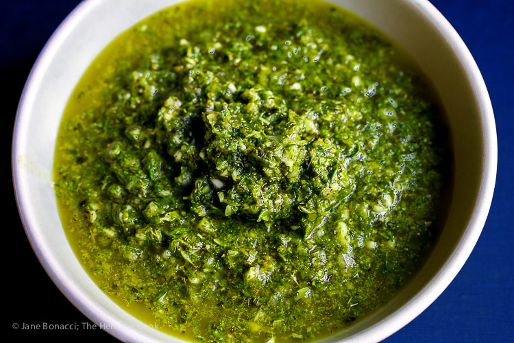 Beautiful bowl of chimichurri sauce made with parsley, rosemary, thyme, and oregano; Flank Steak with Fresh Chimichurri Sauce #ProgressiveEats © 2017 Jane Bonacci, The Heritage Cook