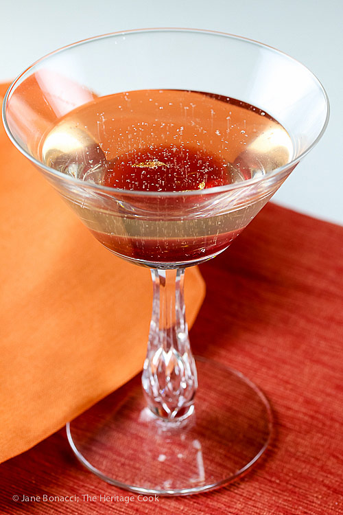 Prosecco cocktail made with the syrup; Oranges in Spiced Wine Syrup and Scenes from Chinon © 2018 Jane Bonacci, The Heritage Cook