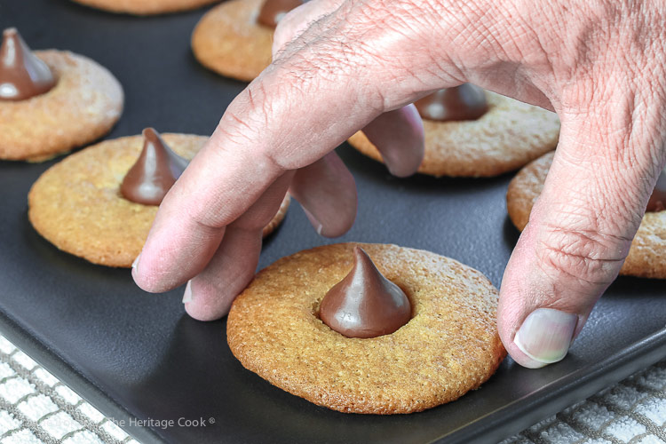 Man's hand reaching to steal a cookie; Gluten Free Chocolate Kiss Cookies © 2018 Jane Bonacci, The Heritage Cook