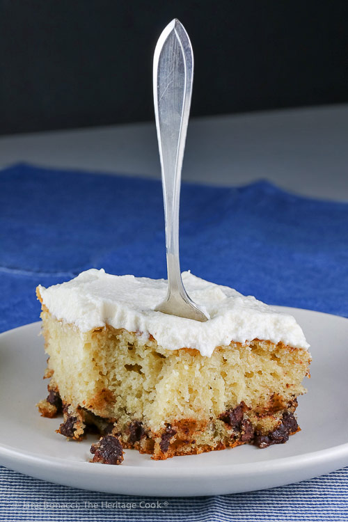 slice of cake with a fork stuck in it; Chocolate Chip Dalmatian Sheet Cake with Vanilla Buttercream Frosting © 2018 Jane Bonacci, The Heritage Cook