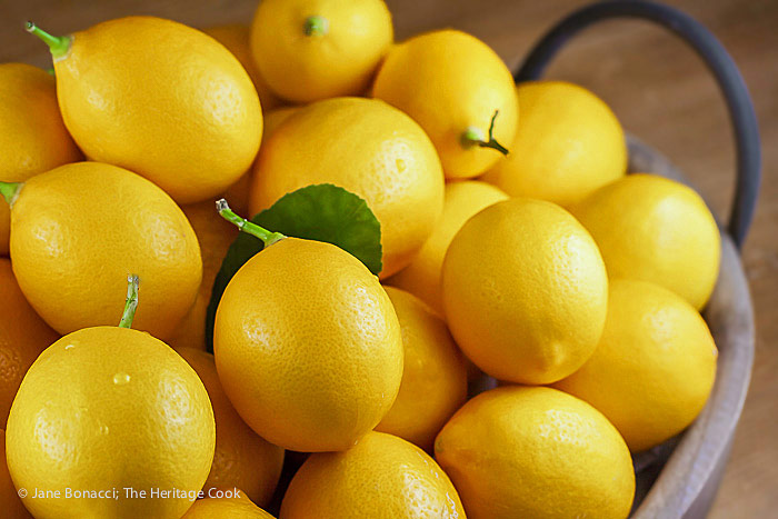 Pile of fresh meyer lemons; Scallops in Garlic Shallot Butter Sauce © 2018 Jane Bonacci, The Heritage Cook