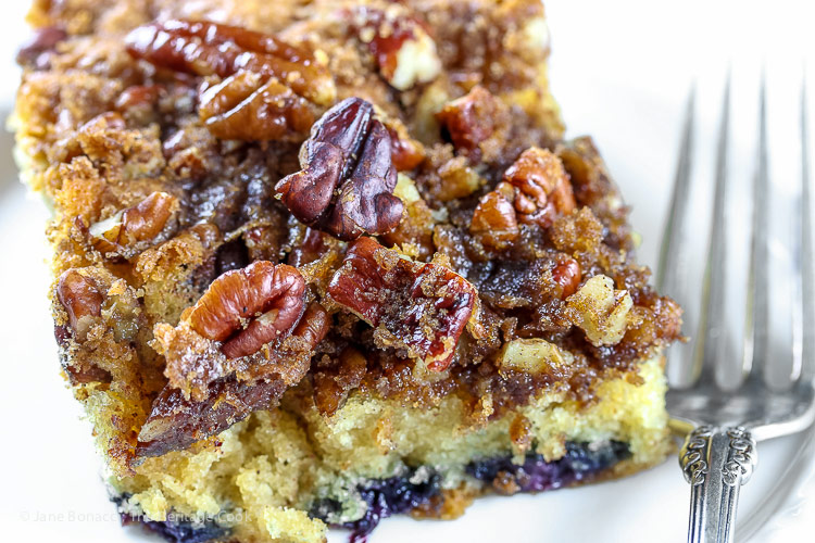 close up of pecan streusel on top of slice; Blueberry Coffee Cake © 2018 Jane Bonacci, The Heritage Cook