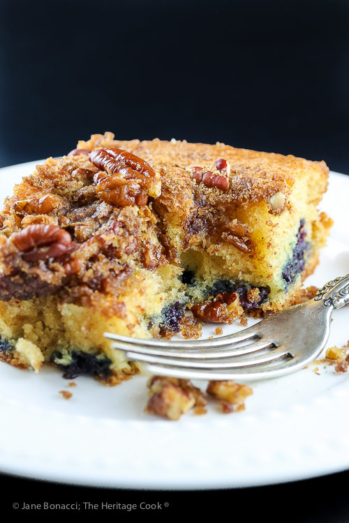 bite taken out of slice of coffee cake with fork on plate; Blueberry Coffee Cake © 2018 Jane Bonacci, The Heritage Cook