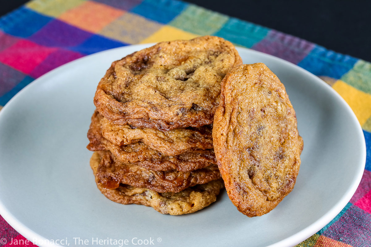 Somewhat lumpy cookies that look like chocolate chip but have Butterfinger candies in them too; Butterfinger Chocolate Chip Cookies © 2022 Jane Bonacci, The Heritage Cook.