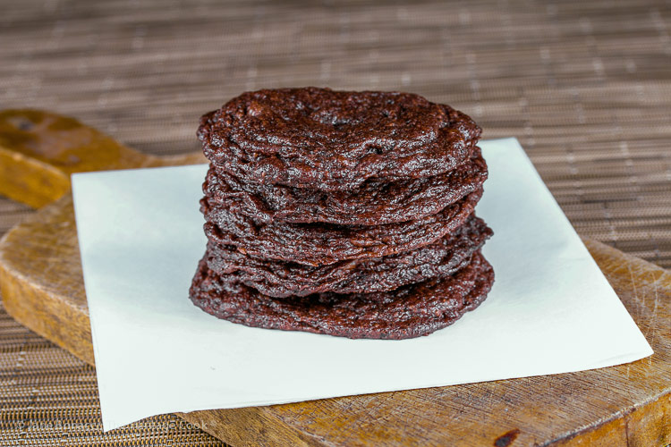stack of cookies on parchment; Secret Ingredient Crispy Chocolate Cookies © 2019 Jane Bonacci, The Heritage Cook