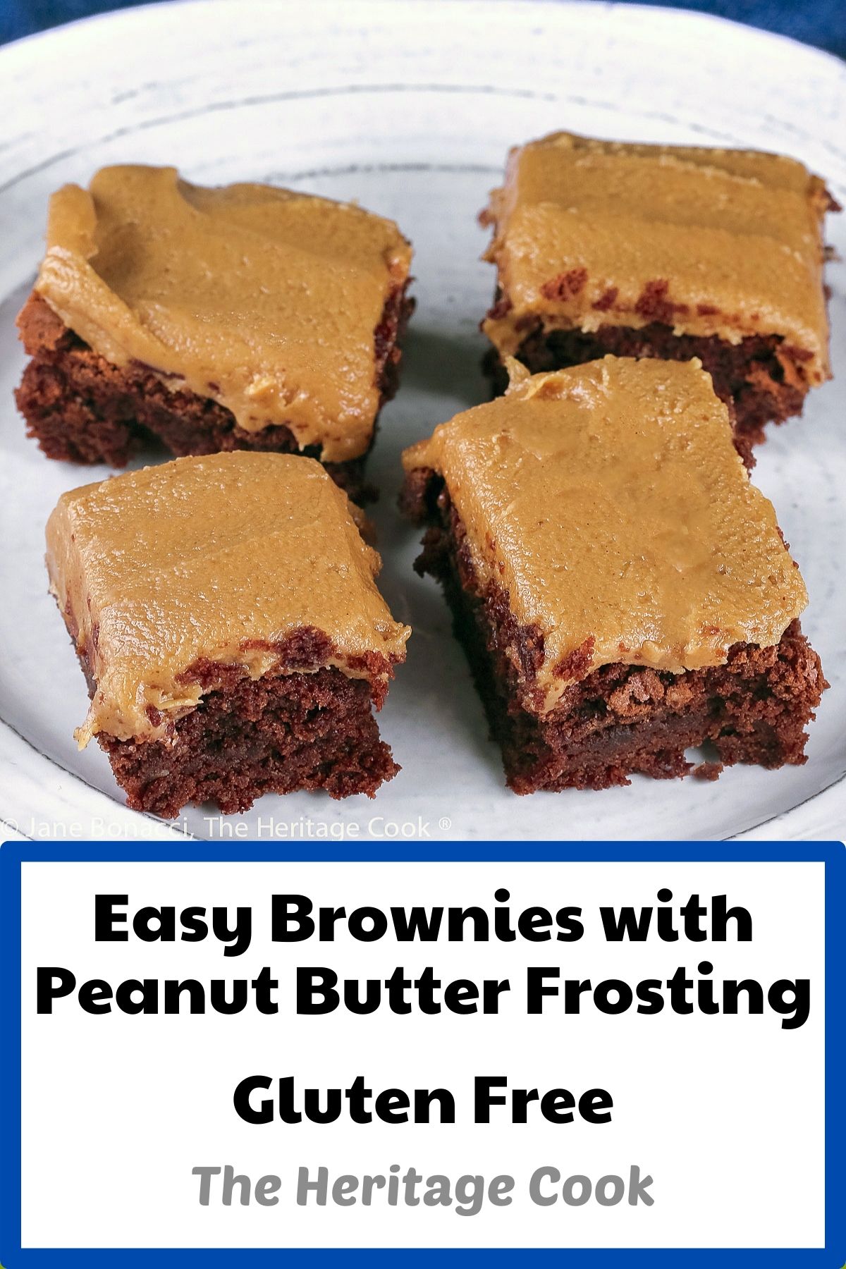 Squares of brownies topped with thick peanut butter frosting, on a white plate with a blue background; © 2023 Jane Bonacci, The Heritage Cook. 