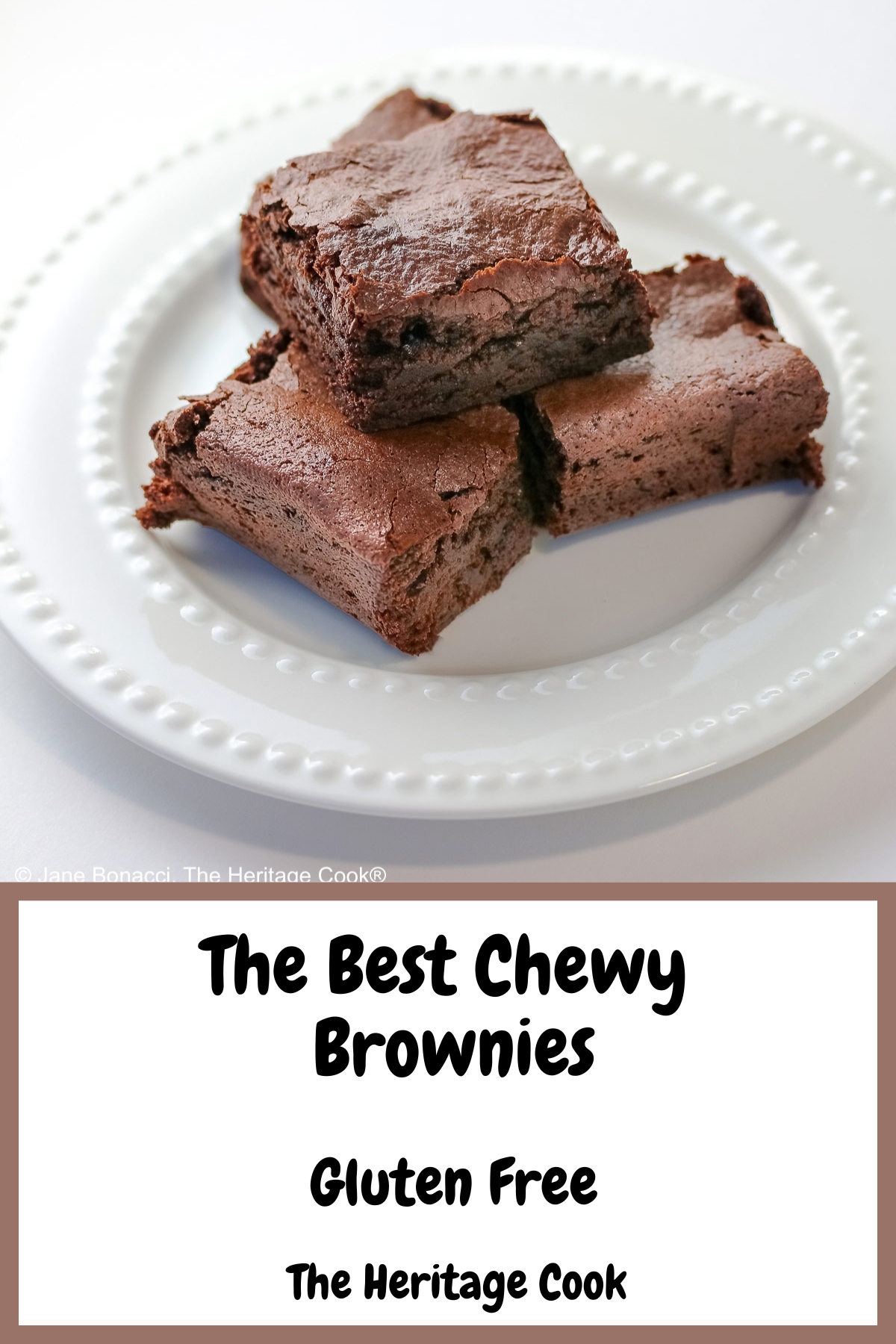 The Best Chewy Brownies, rich and so chocolatey, stacked on a white plate with two rows of white pearls, sitting on a white background; some shots of the cookbook, “Bittersweet” by Alice Medrich; © 2025 Jane Bonacci, The Heritage Cook.
