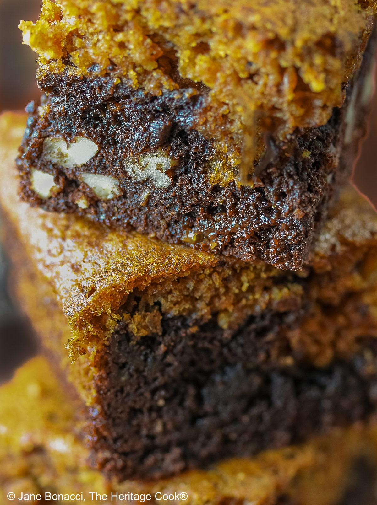 Close up tight shot of the 3 in a stack of pumpkin swirl brownies.