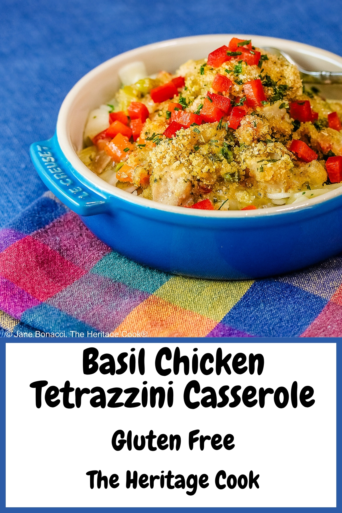 A blue round baking dish with handles on a vivid blue background, most with a bright multi-colored cloth beneath, some with a fork on the side, some with a white square plate beneath the bowl © 2026 Jane Bonacci, The Heritage Cook.