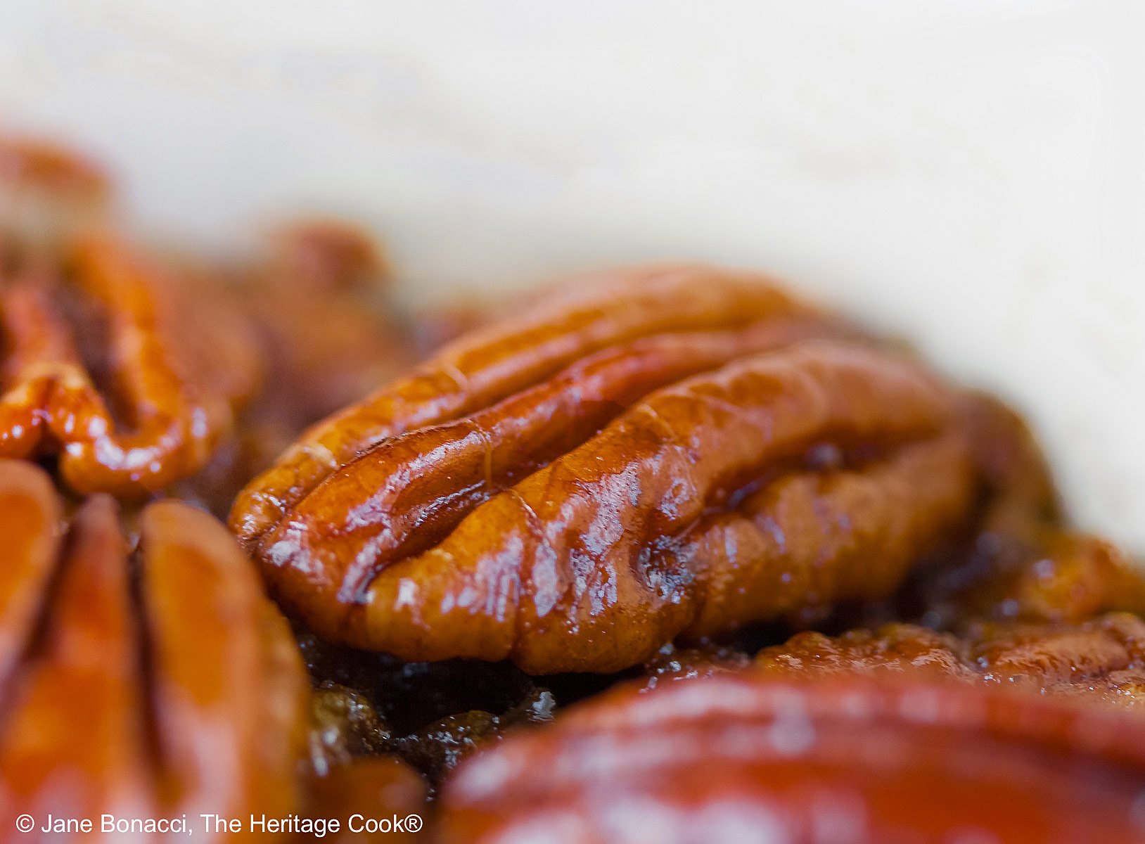 Close up shot of pecans hot from the oven.
