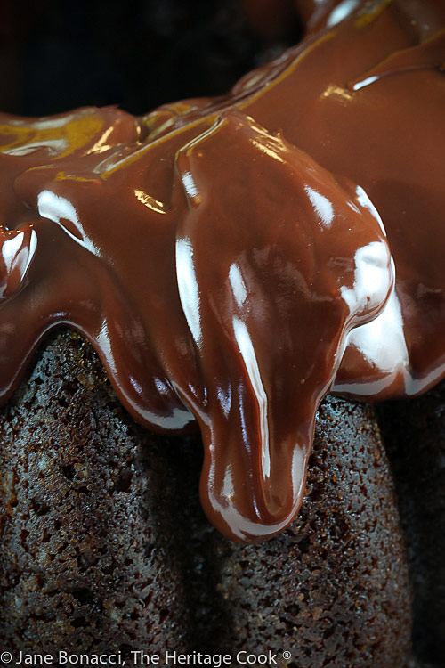 Irresistible drip of the chocolate glaze on a chocolate bundt cake
