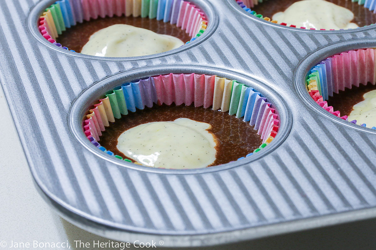 ready for baking, batter in cupcake liners in pan; Black Bottom Cupcakes, chocolate cupcakes with cheesecake-like filling © 2022 Jane Bonacci, The Heritage Cook