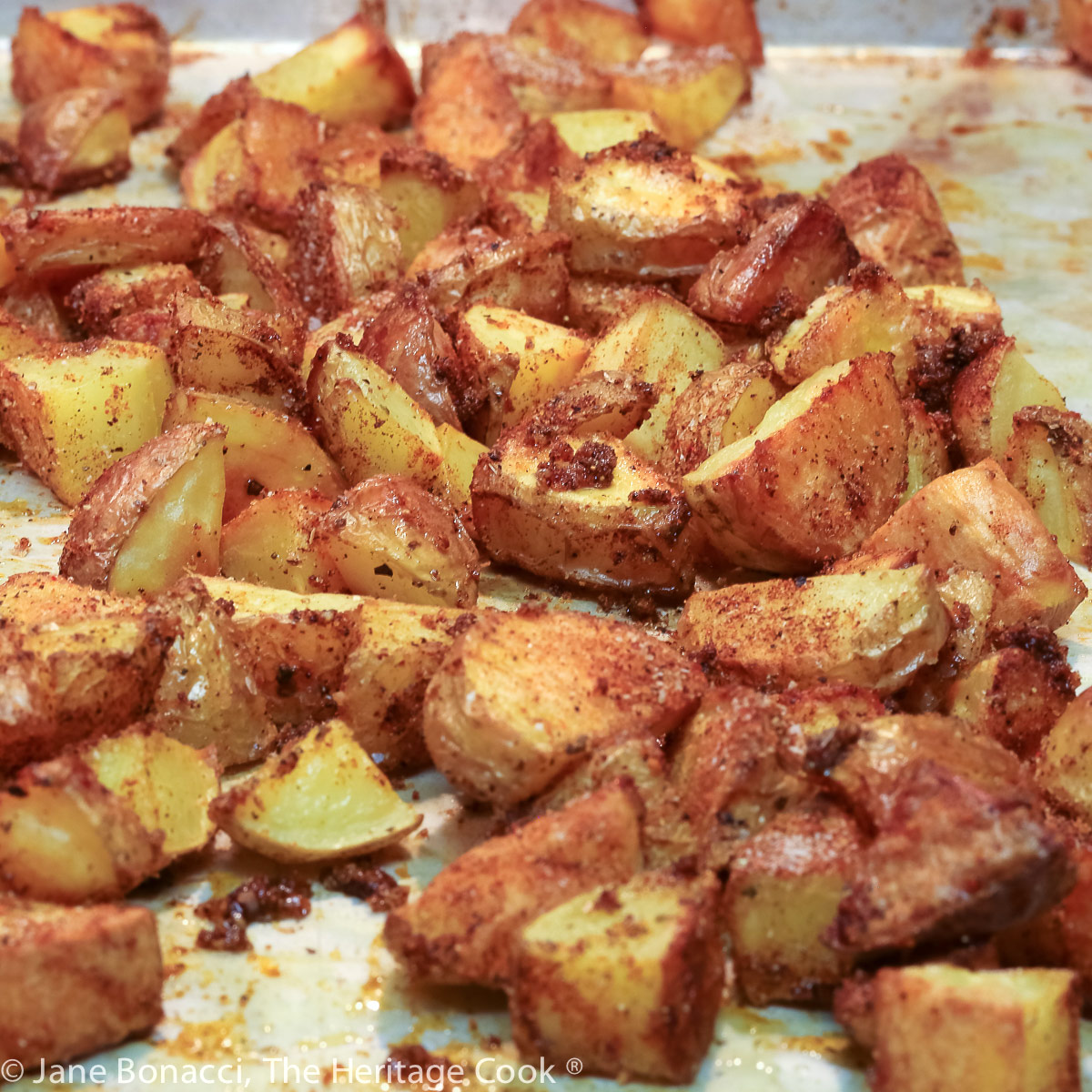oven-roasted cubed potatoes on a baking sheet