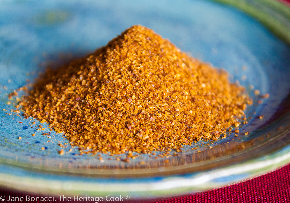 Pile of taco seasoning on a blue plate; Tex-Mex Skillet Dinner from The Migraine Relief Plan Cookbook by Stephanie Weaver © 2022 Jane Bonacci, The Heritage Cook