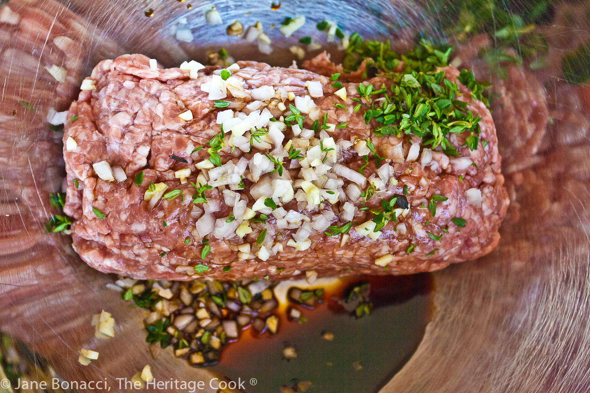 Raw pork and seasonings ready to be formed into patties