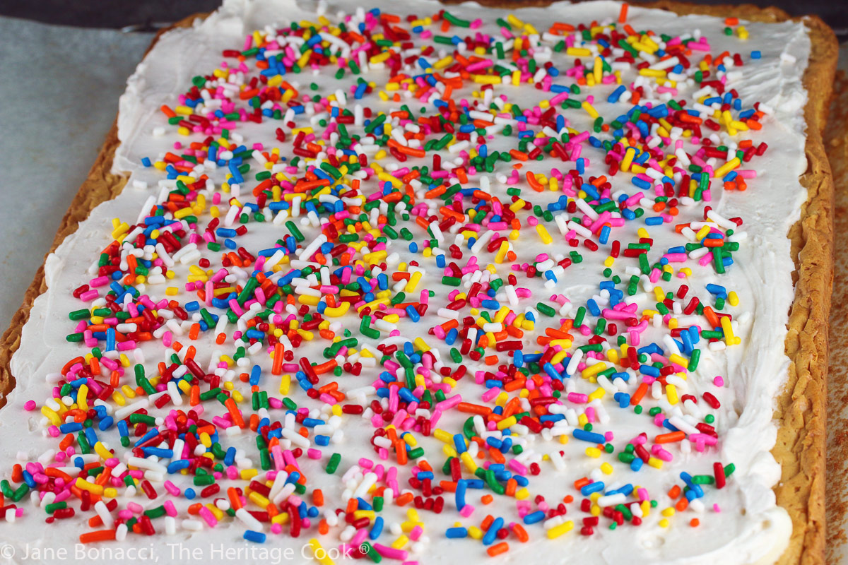Freshly frosted blondies with rainbow sprinkles